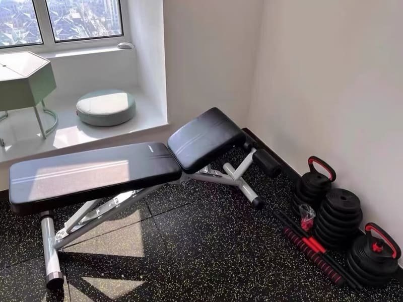 An engineering diagram showing layers of gym flooring, from subfloor to surface